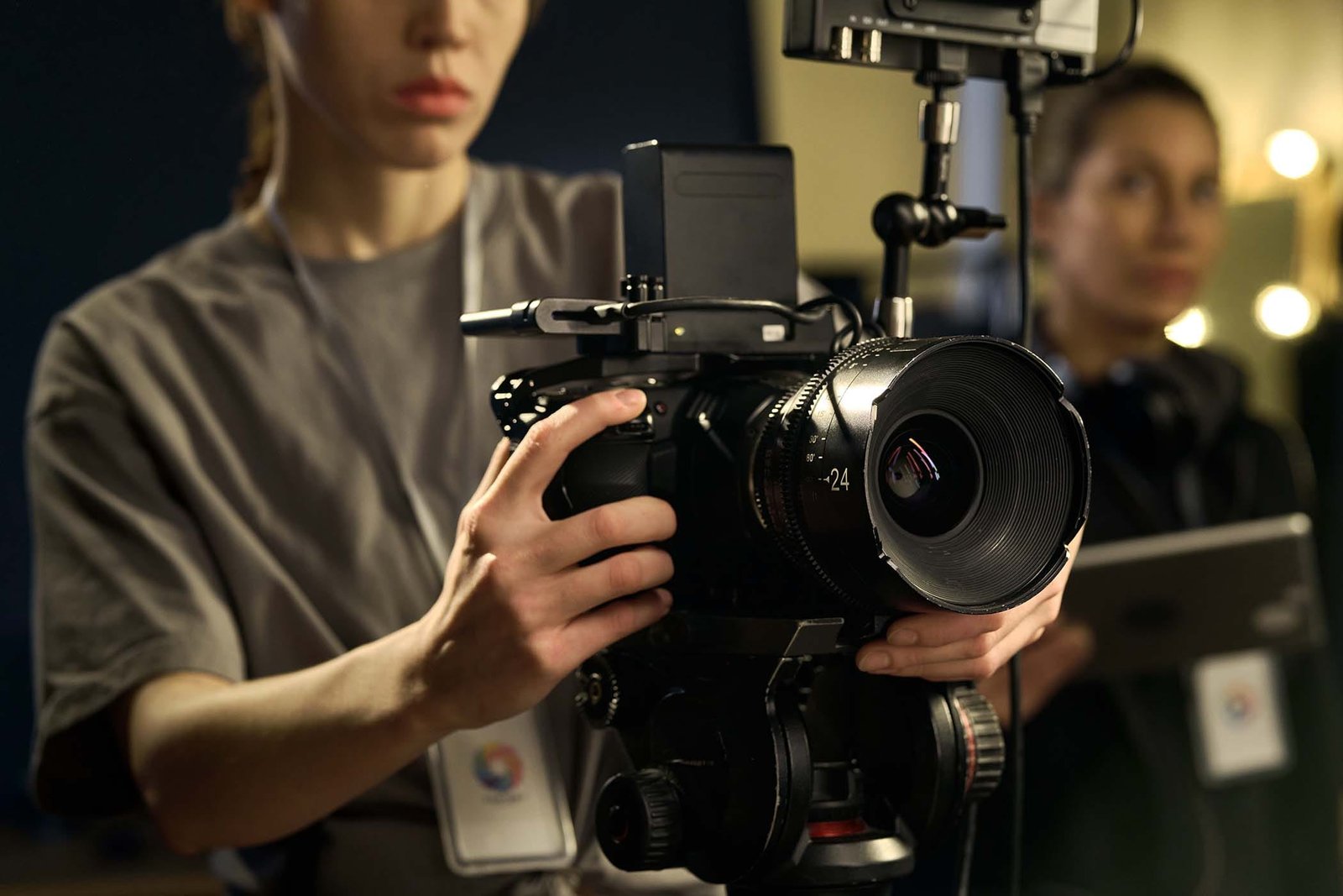 female hands holding professional video camera NZWH8ZK